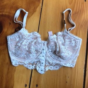 Lace unlined bra with front clasp details.